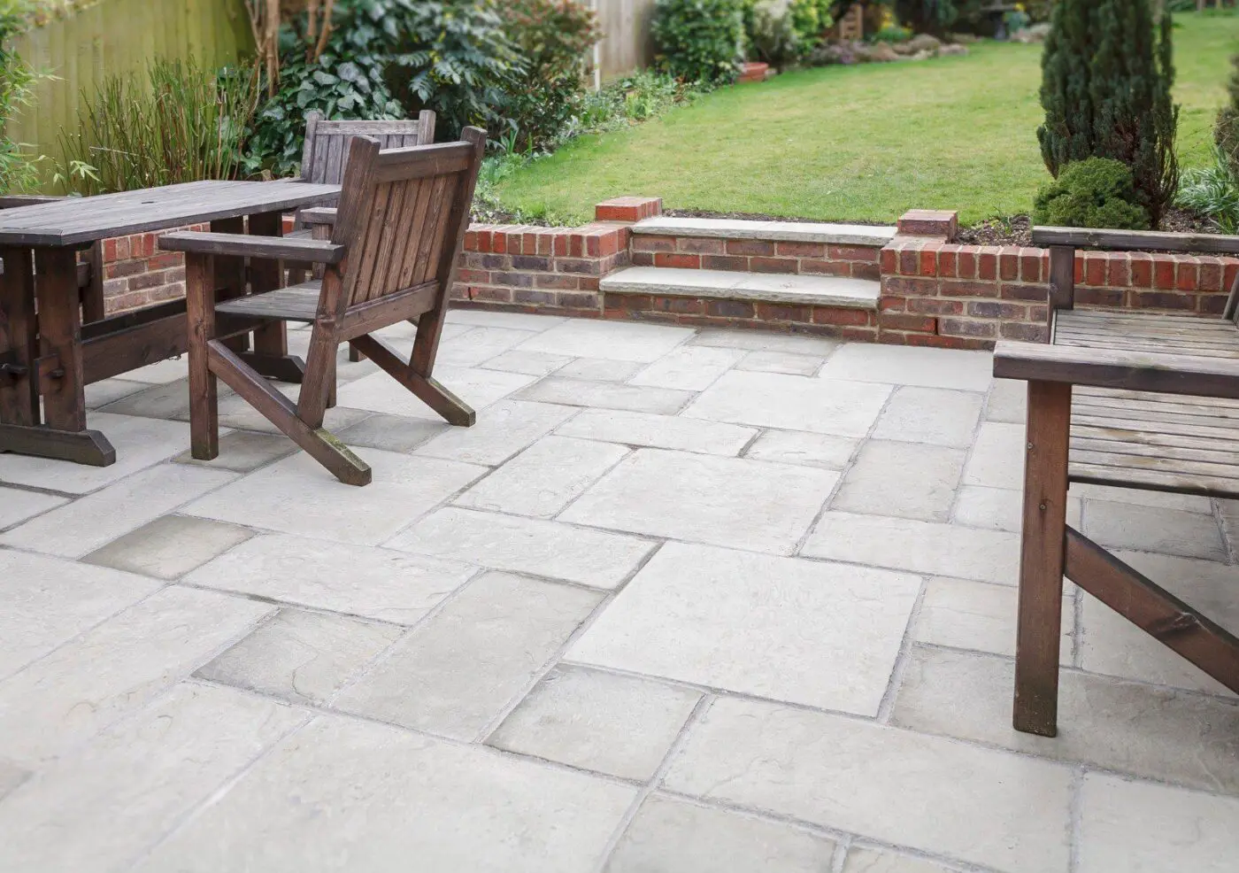 this patio in Delray Beach, FL features natural stone flooring