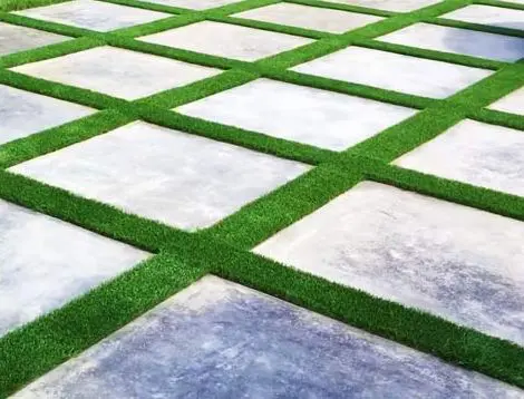 artificial grass installed between pavers to make driveway in Delray Beach, FL unique