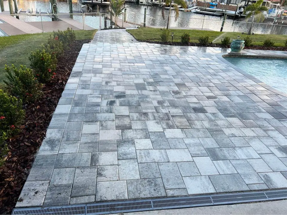 gray stone pavers next to a pool in Palm Beach FL